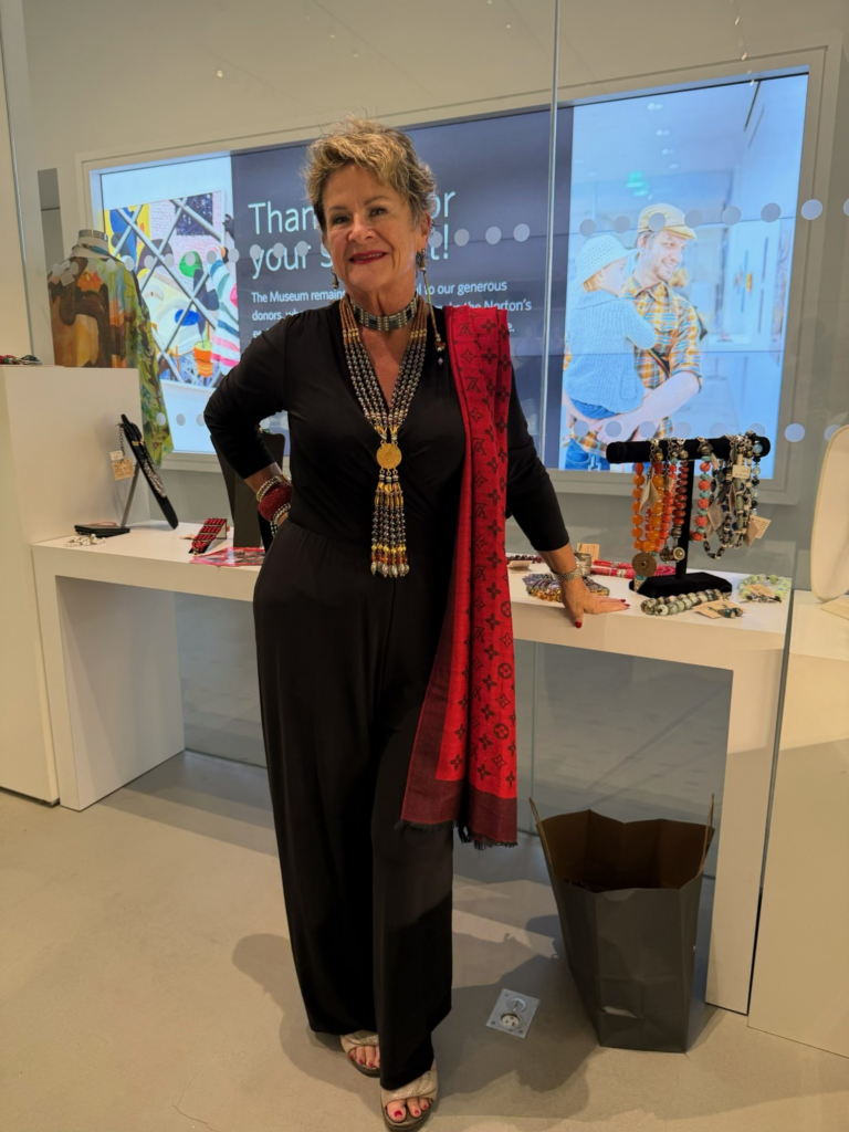 Joan Winters presenting trunk show of Masha Archer jewelry at the Norton Museum of Art gift shop.